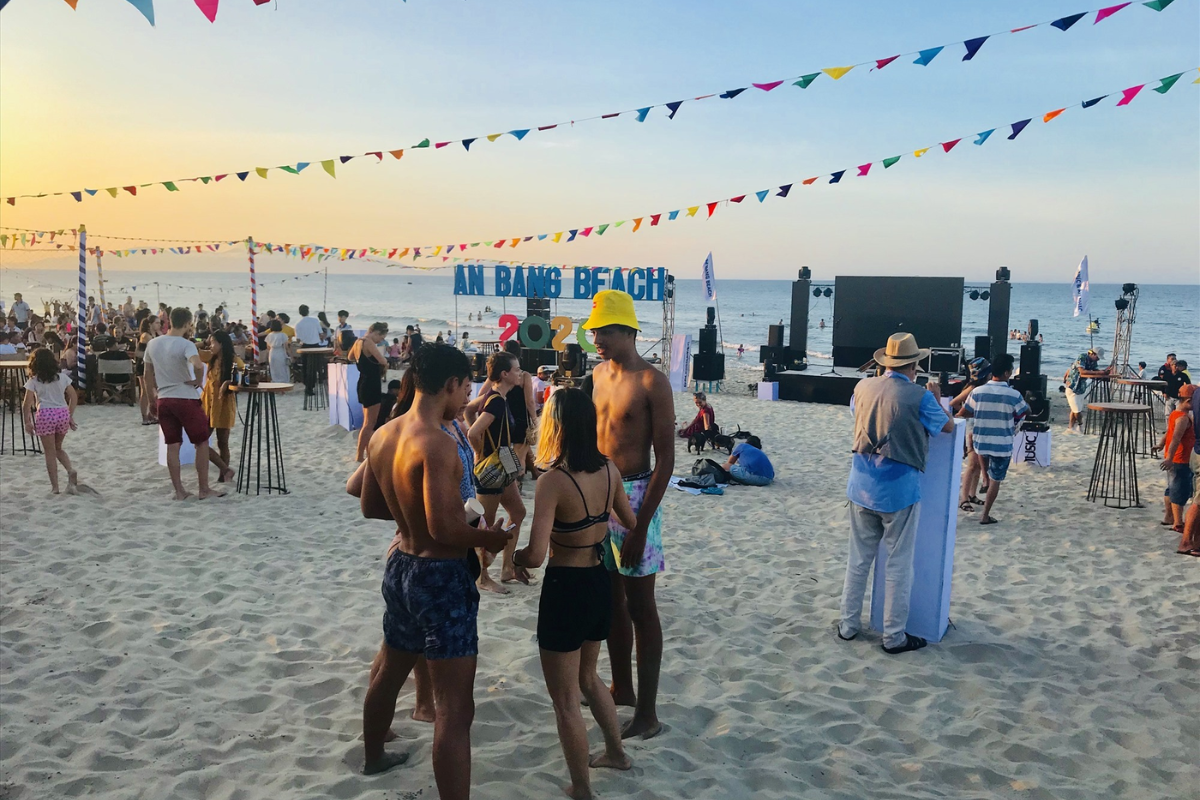 Tourists relaxing on An Bang Beach in the summer sun