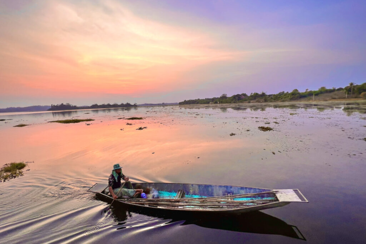 Long-tail boat cruising toward the Golden Triangle