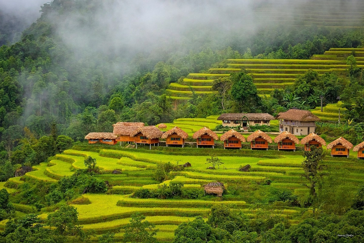 Cool and misty morning in Ha Giang with mountains in the background