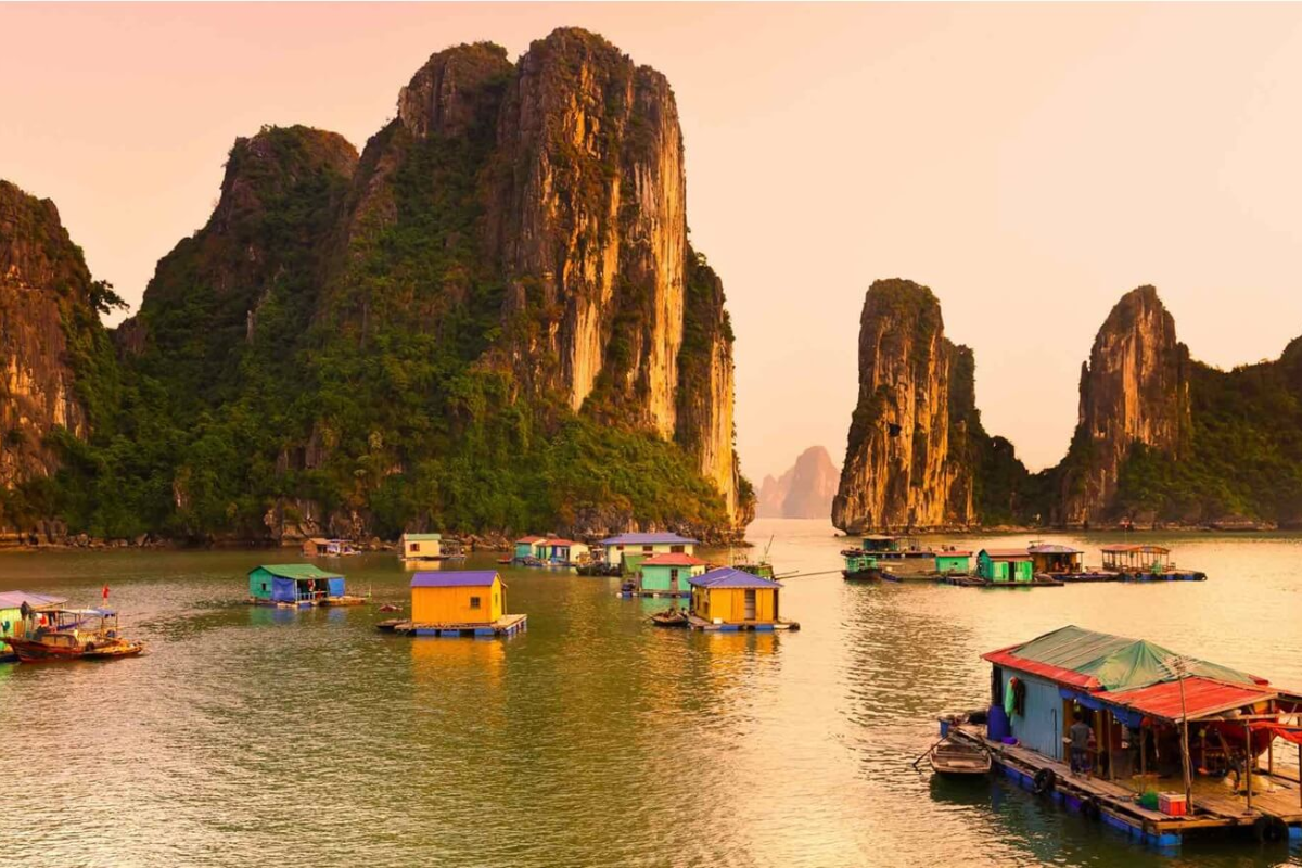 Tourist enjoying a peaceful rowboat ride through Ha Long Bay’s fishing village