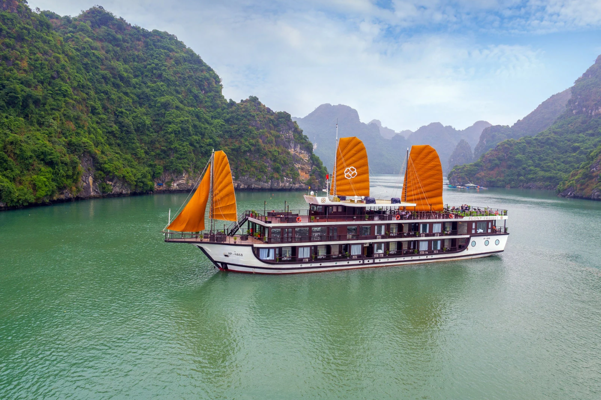 Luxury cruise gliding through the limestone karsts of Ha Long Bay