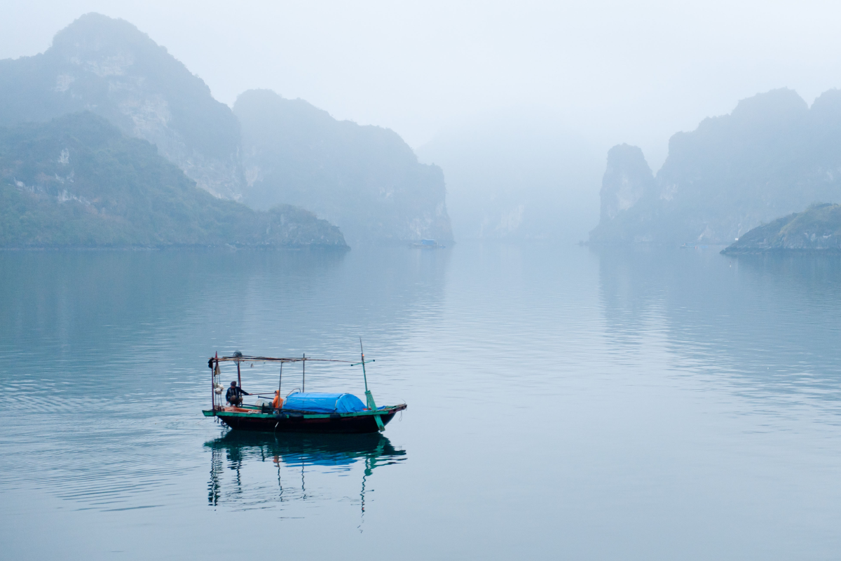 Fog covering limestone karsts in Ha Long Bay during December