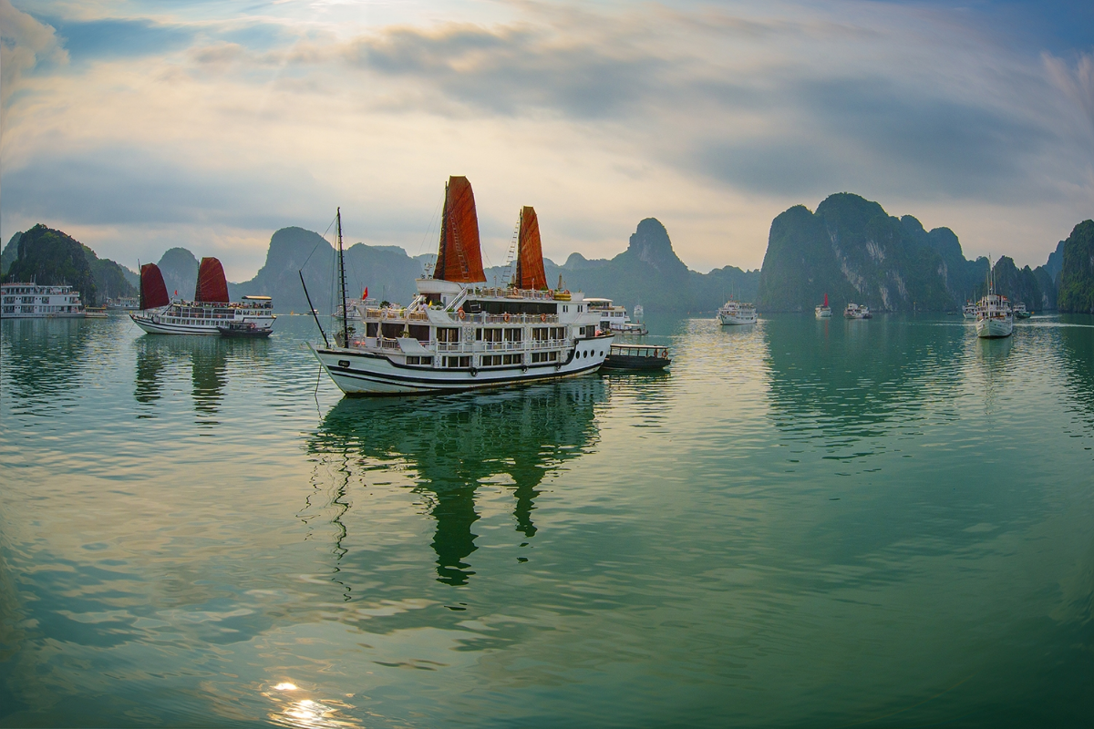A cruise ship under cloudy skies in Ha Long Bay during March