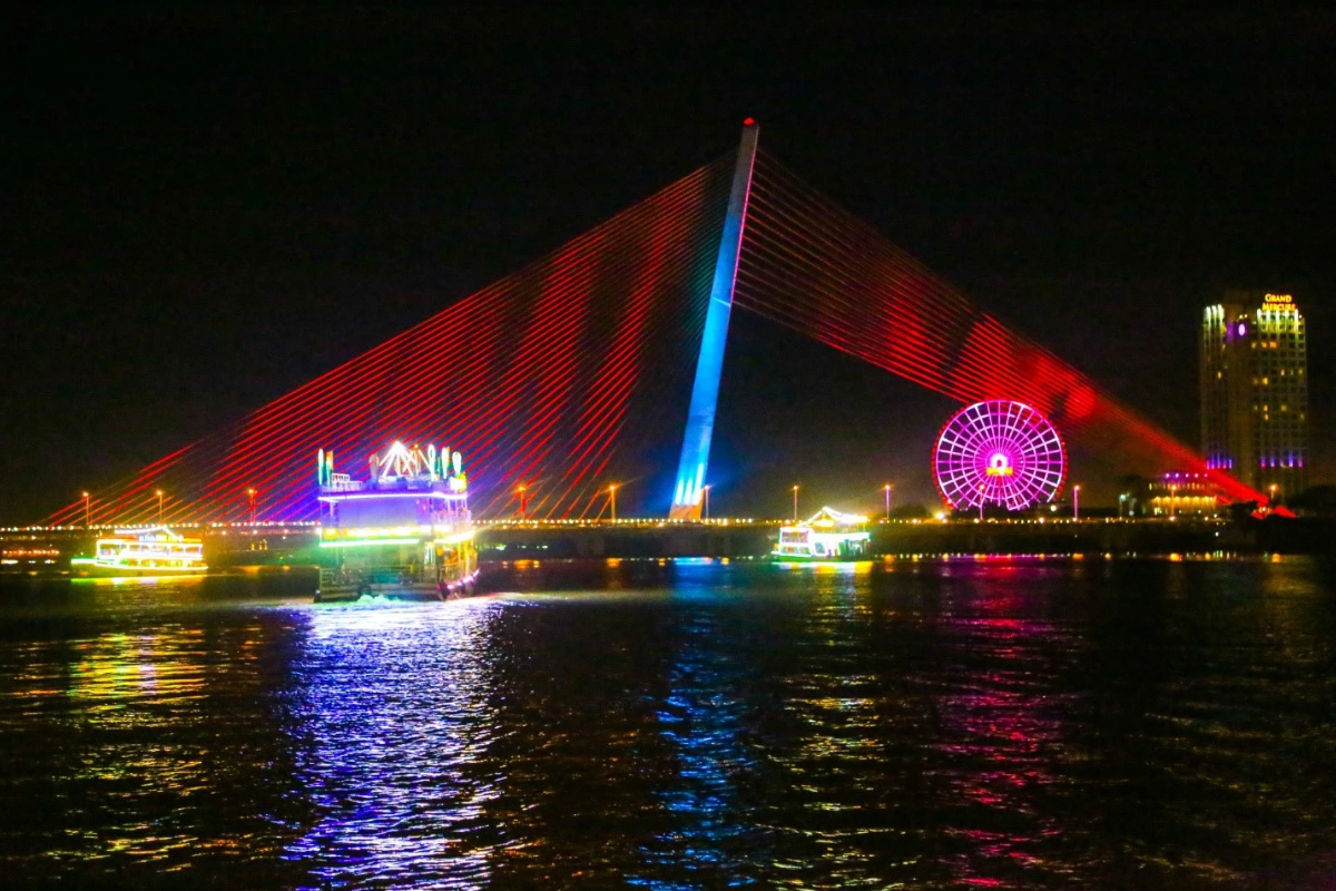Han River Bridge lit up at night with reflections in the water