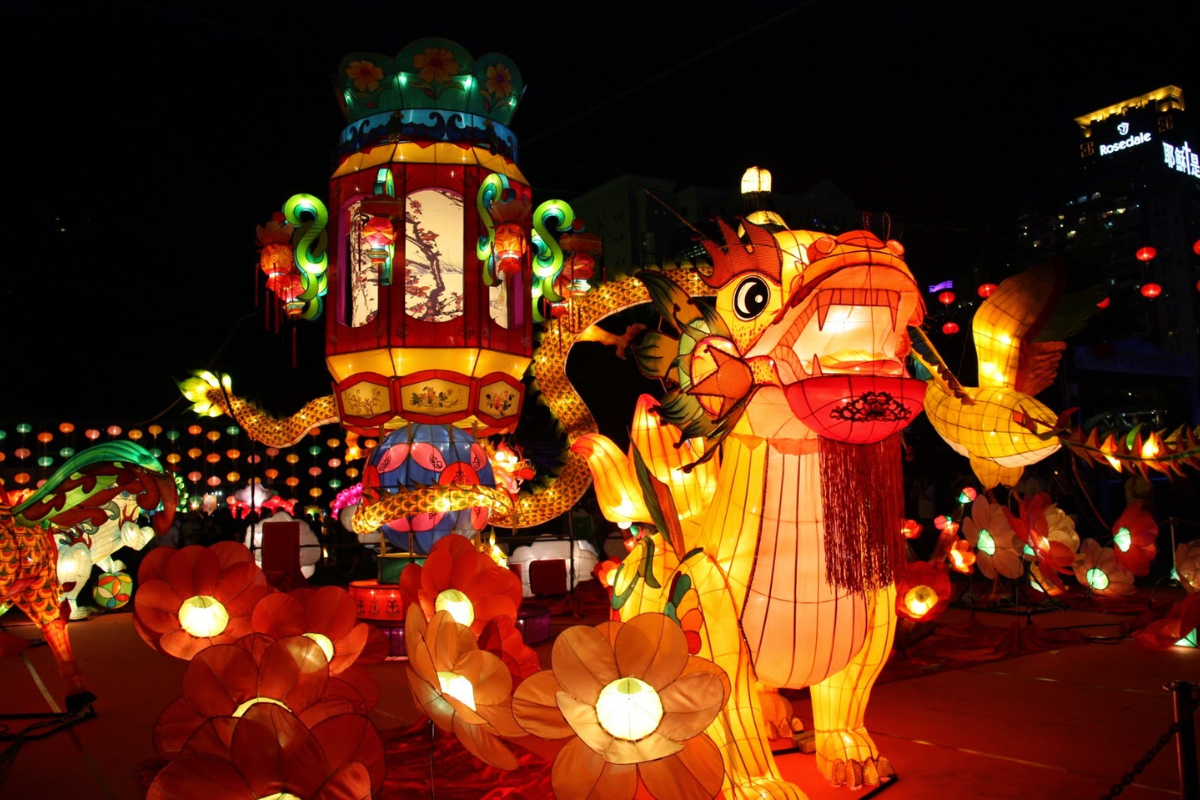 Children parading with colorful lanterns during Hoi An's Mid-Autumn Festival