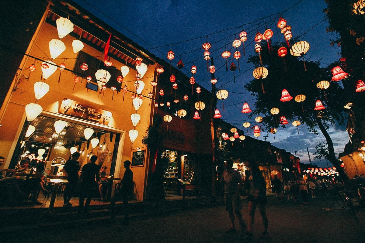 Colorful lanterns lighting up the streets of Hoi An Ancient Town at dusk