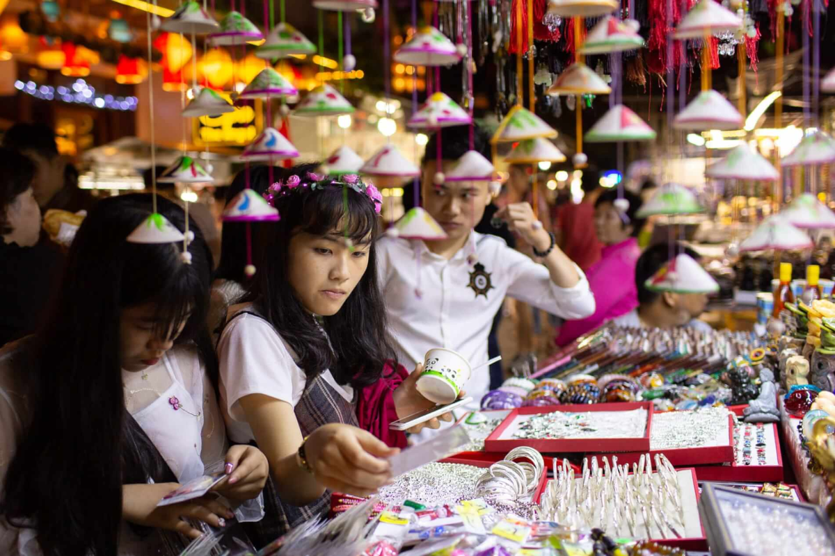 Crowds enjoying street food at Hoi An Night Market in December