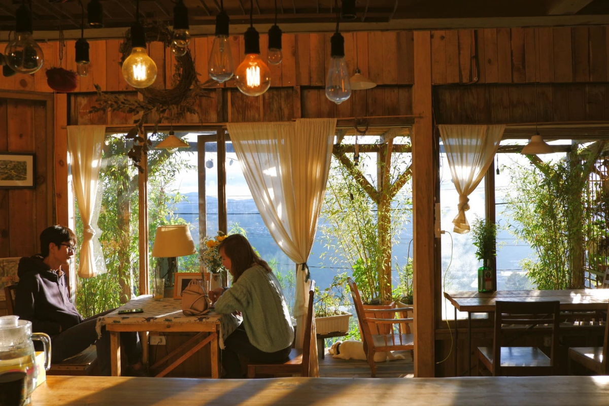 Indoor cafe in Da Lat with mountain view through large windows