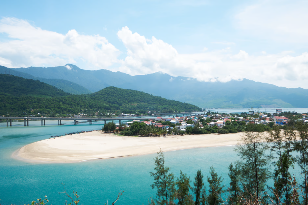 Lang Co Beach with white sand and turquoise water on a sunny day