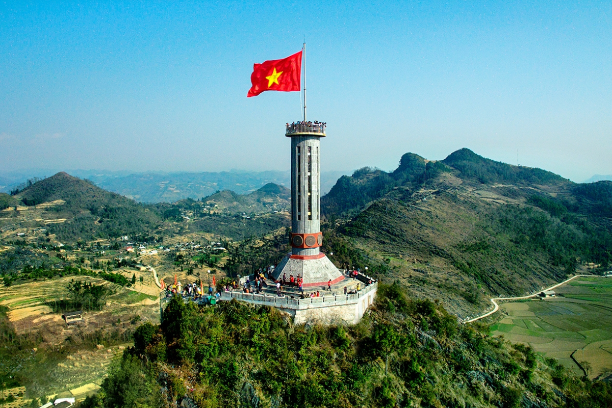 Vietnam’s red flag with a yellow star flying at Lung Cu Flag Tower