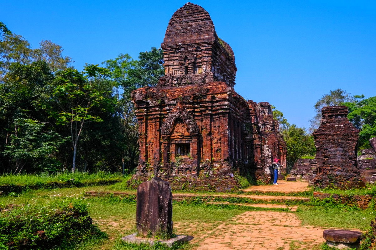 Ancient temple ruins at My Son Sanctuary surrounded by lush greenery