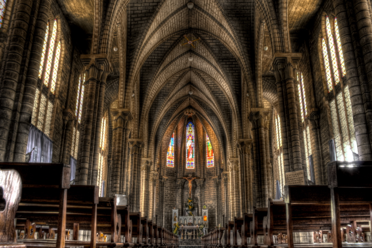 Interior hall of Nha Trang Cathedral with Gothic arches and religious artwork