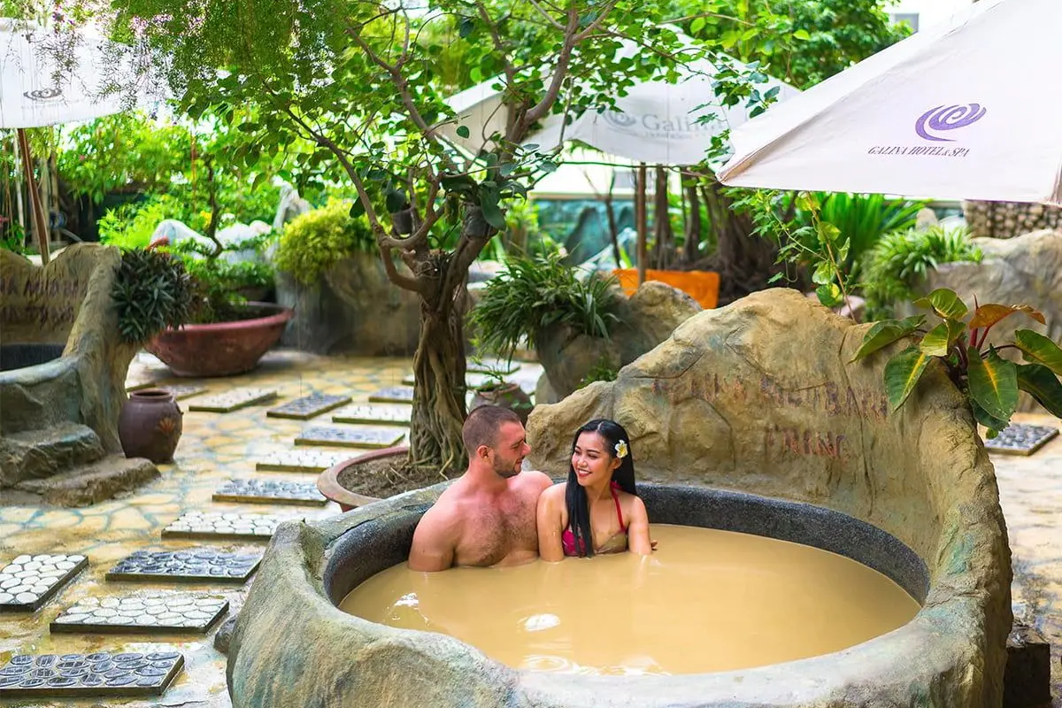 Travelers relaxing in a Nha Trang mud bath 
