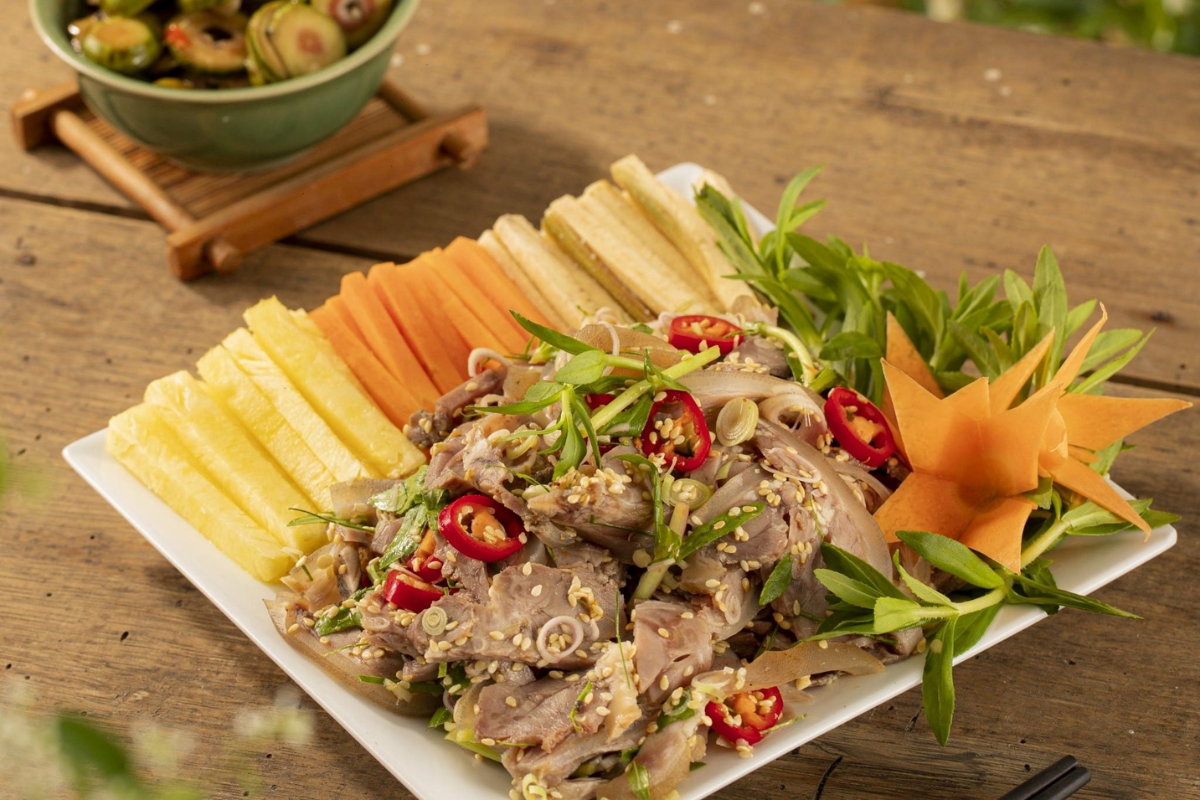 Traditional Ninh Binh mountain goat meat served with herbs and dipping sauce