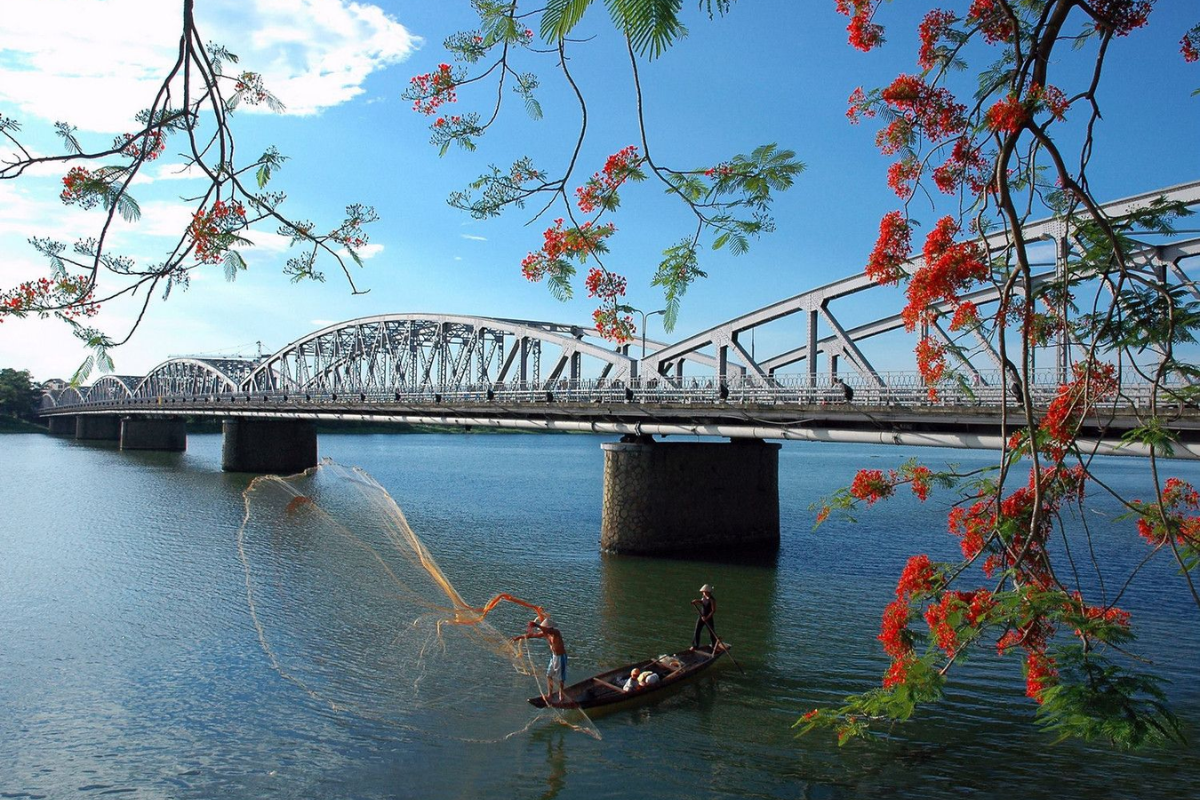 Scenic view of the Perfume River in Hue during October with blue skies and calm water.