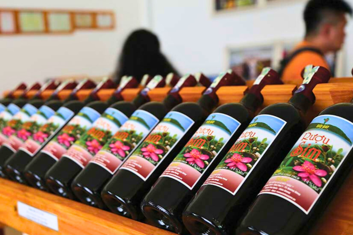 Bottles of Rượu Sim wine made from rose myrtle berries on display