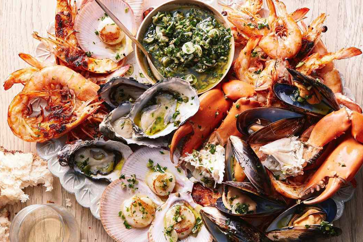 Traditional seafood dishes from Ha Long Bay served with herbs and rice noodles