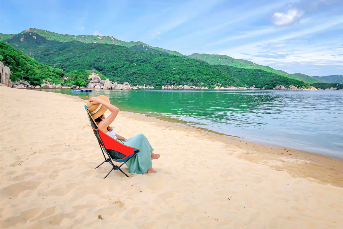 A Tourist enjoying a sunny day on the beach in Nha Trang