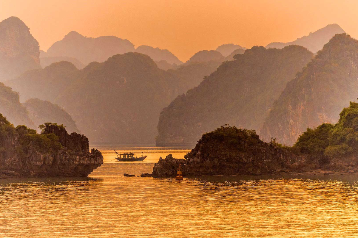 Cruise ship in Halong Bay during sunset in May