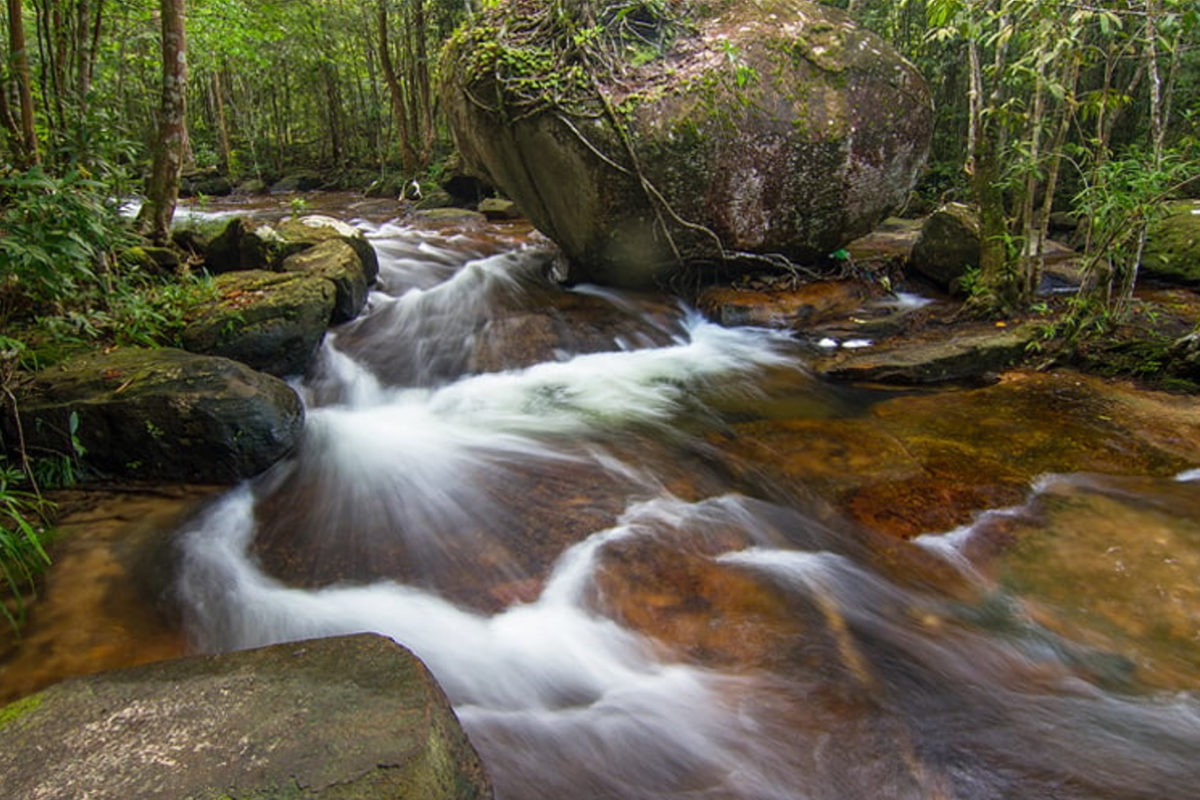Wide flat rocks and waterfall at Suối Đá Bàn Spring in Phu Quoc