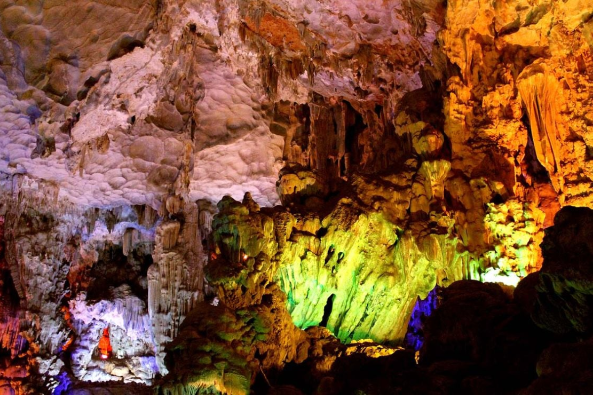 Stalactites and colorful lighting inside Thien Cung Cave in Ha Long Bay