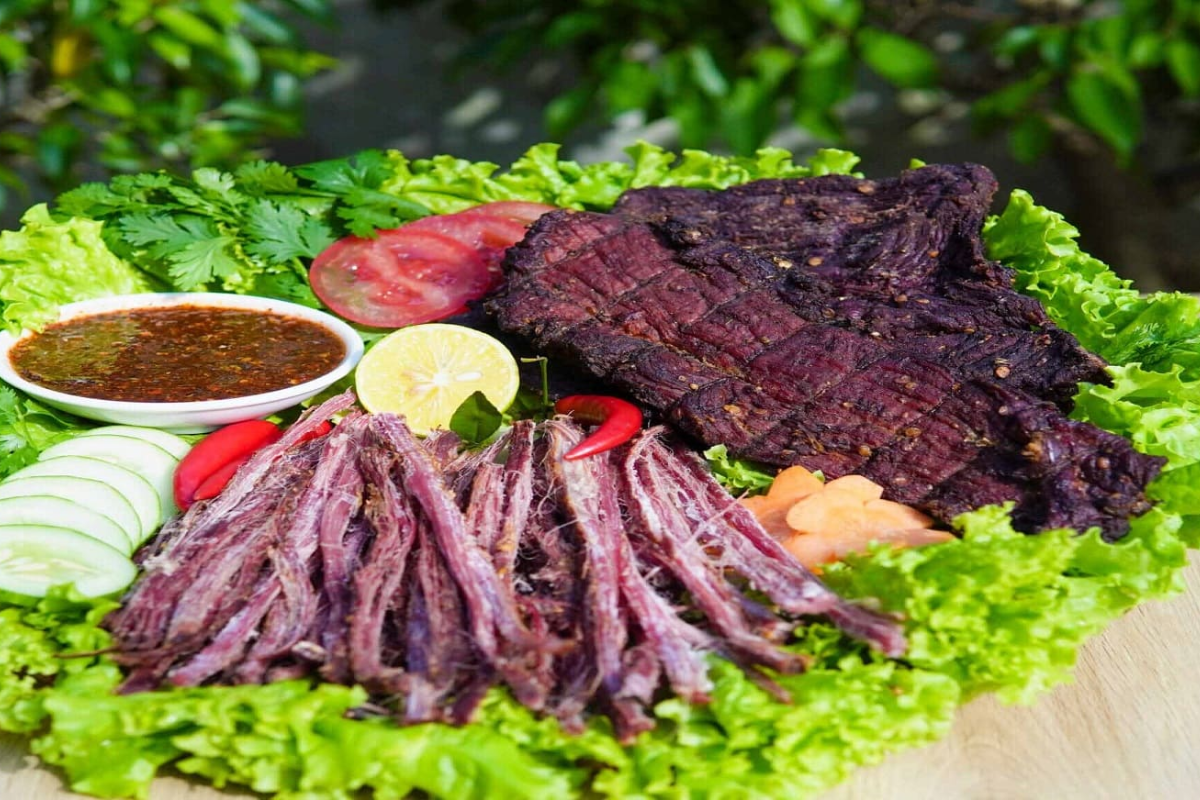 Slices of smoked buffalo meat prepared in the traditional Black Thai style in Sapa