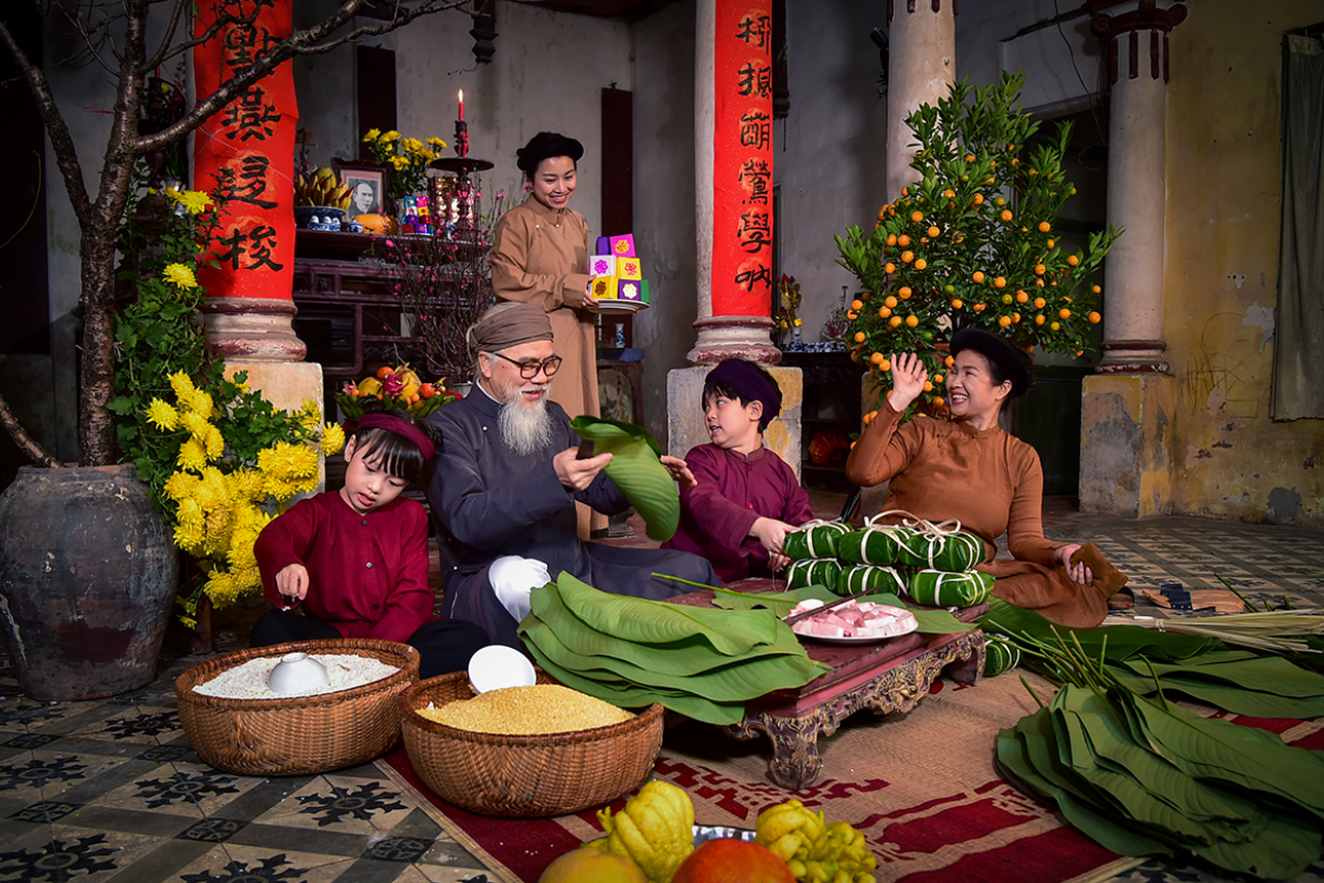 Villagers preparing food together during a traditional Vietnamese celebration