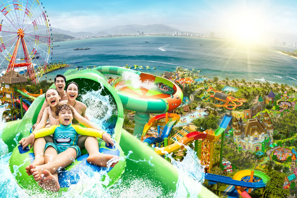 Families and visitors enjoying water slides and roller coasters at VinWonders Nha Trang