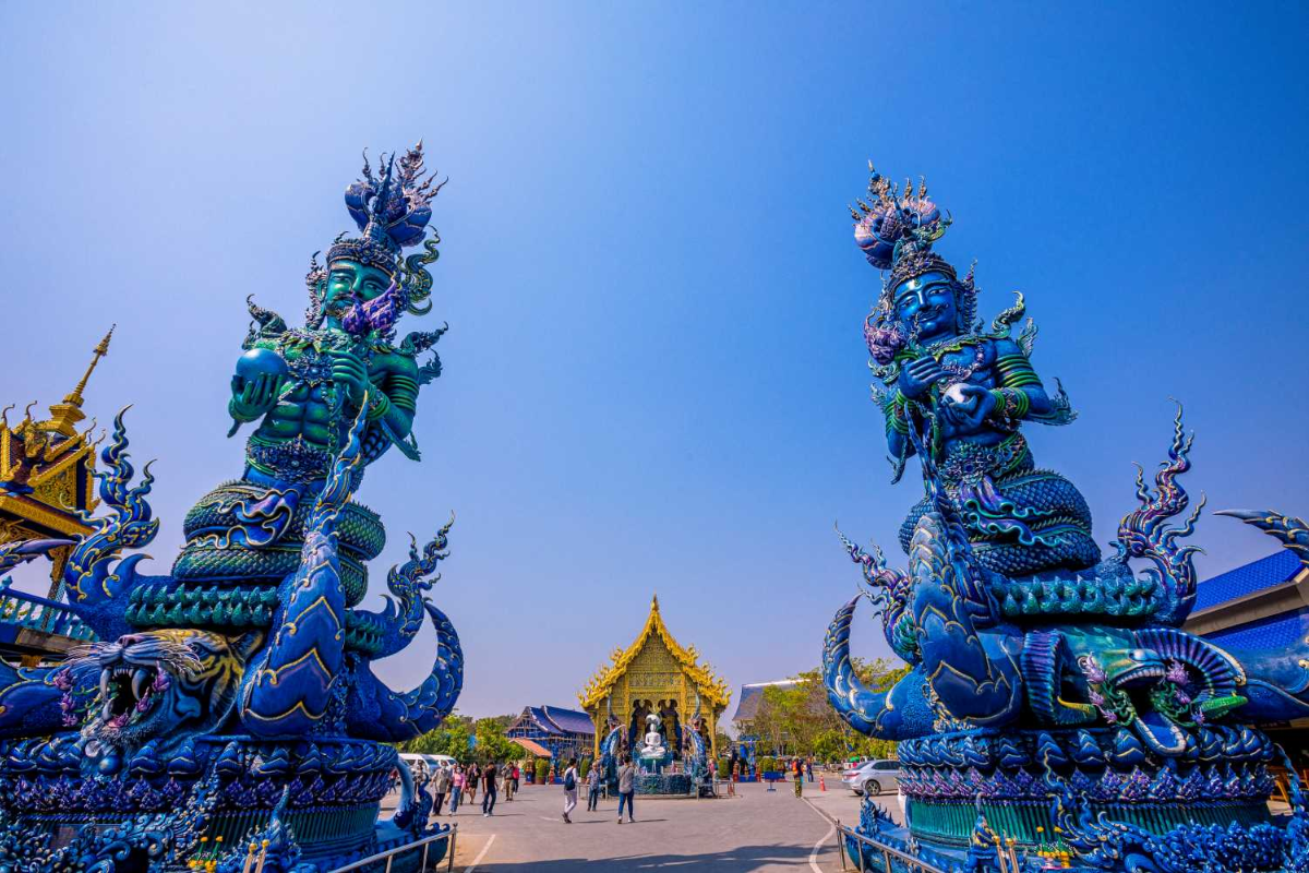 Ornate blue and gold details at Wat Rong Suea Ten
