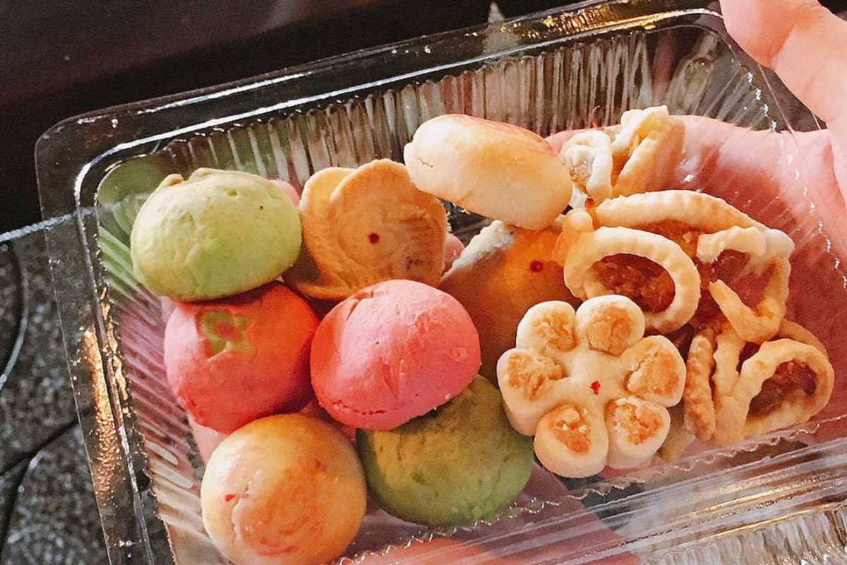 Colorful, flower-shaped Banh Kheo pastries with mung bean and coconut fillings
