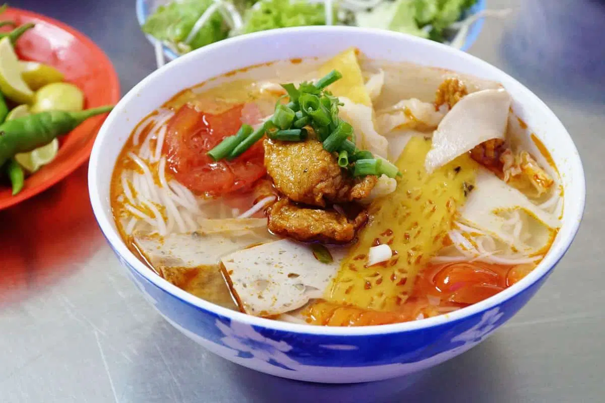 A steaming bowl of fish cake noodle soup
