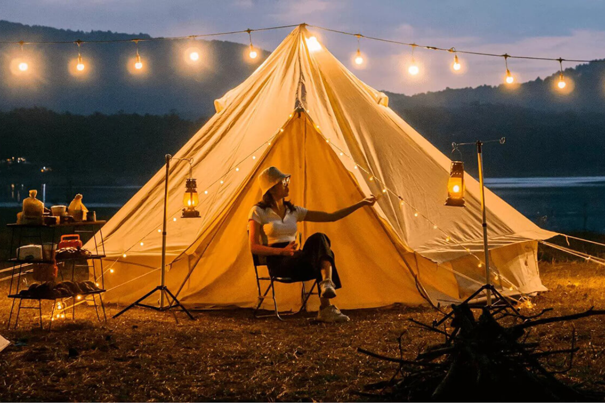 Campers sitting around a campfire in Da Lat