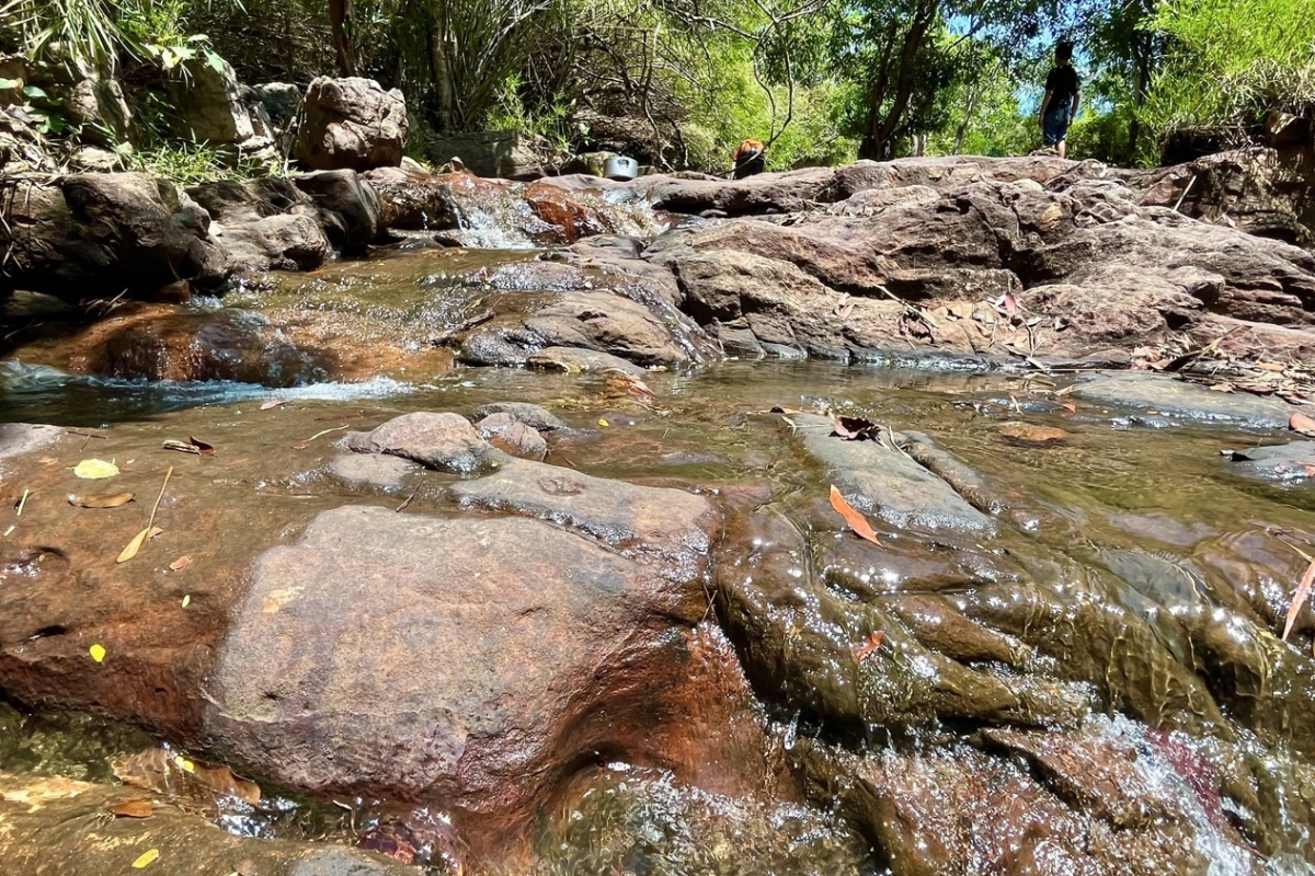 Scenic view of Da Ban Stream in Phu Quoc with crystal-clear water flowing over large rocks