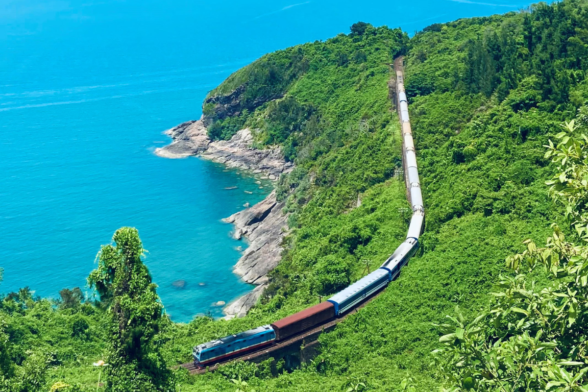 A scenic view of Hai Van Pass with winding roads and lush greenery