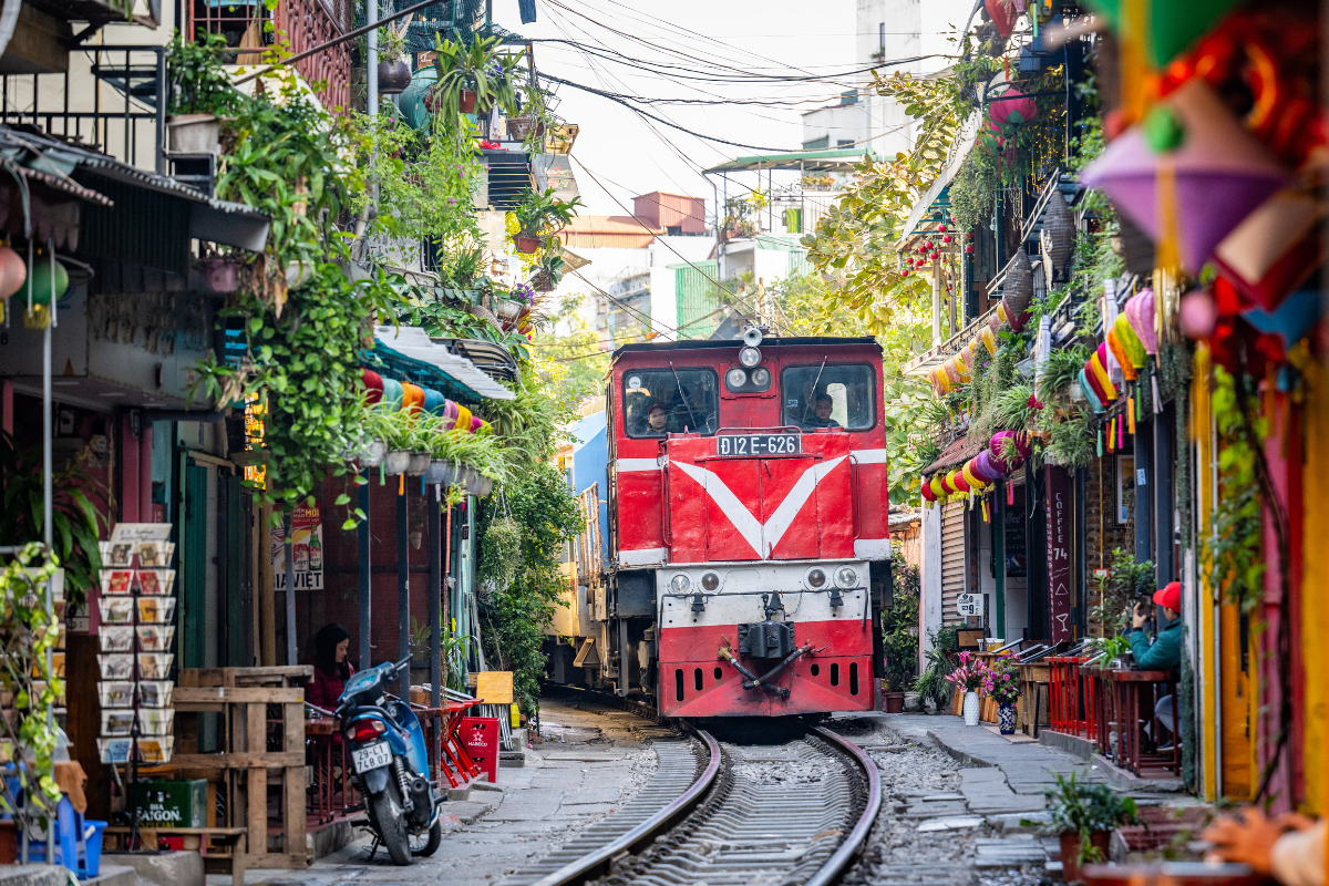 Hanoi Train Street with railway tracks passing through houses and cafes in the Old Quarter
