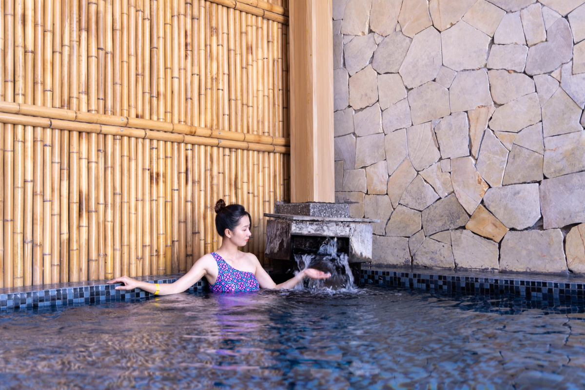 Tourists enjoying a hot spring bath in Ban Ho