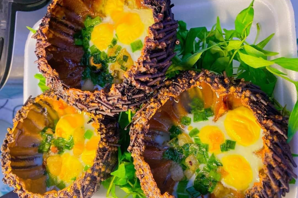 Grilled sea urchins with scallion oil, served on a plate