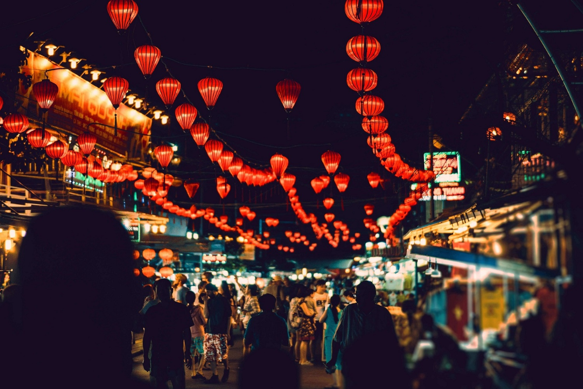 Busy stalls at Phu Quoc Night Market with visitors enjoying street food
