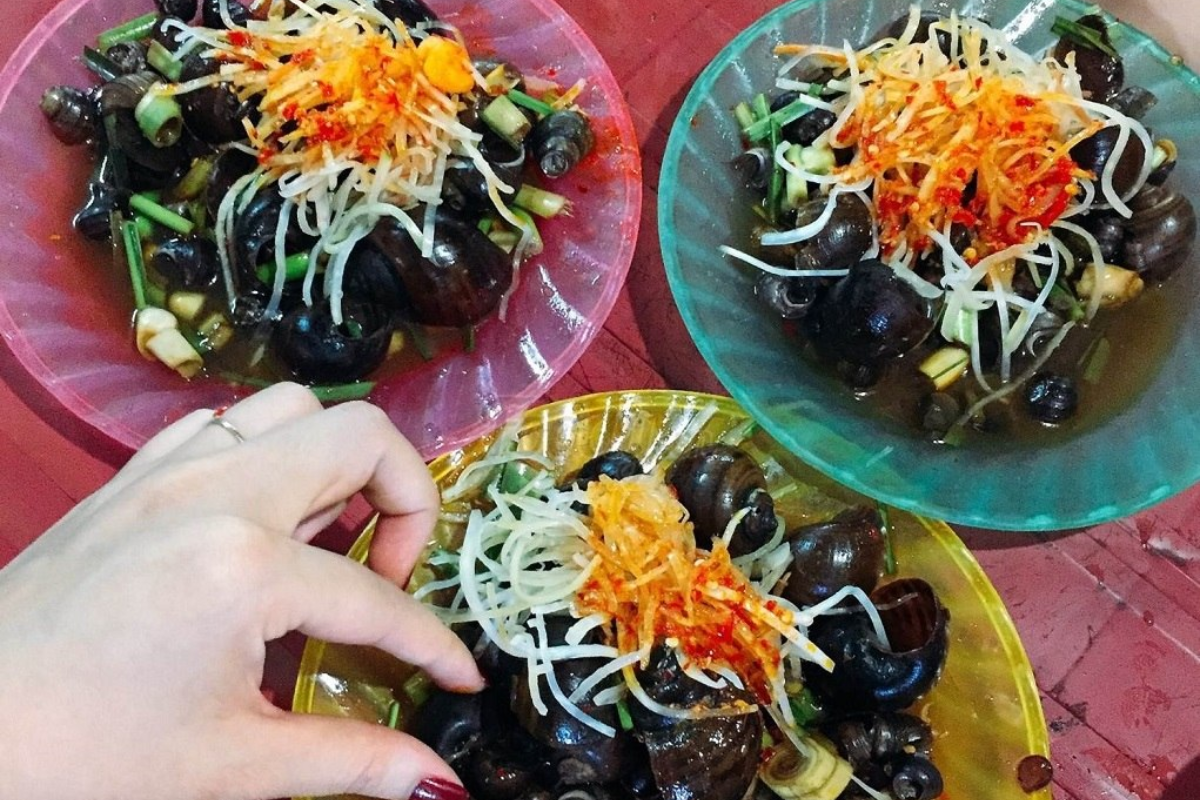 A plate of spicy snails with fresh herbs