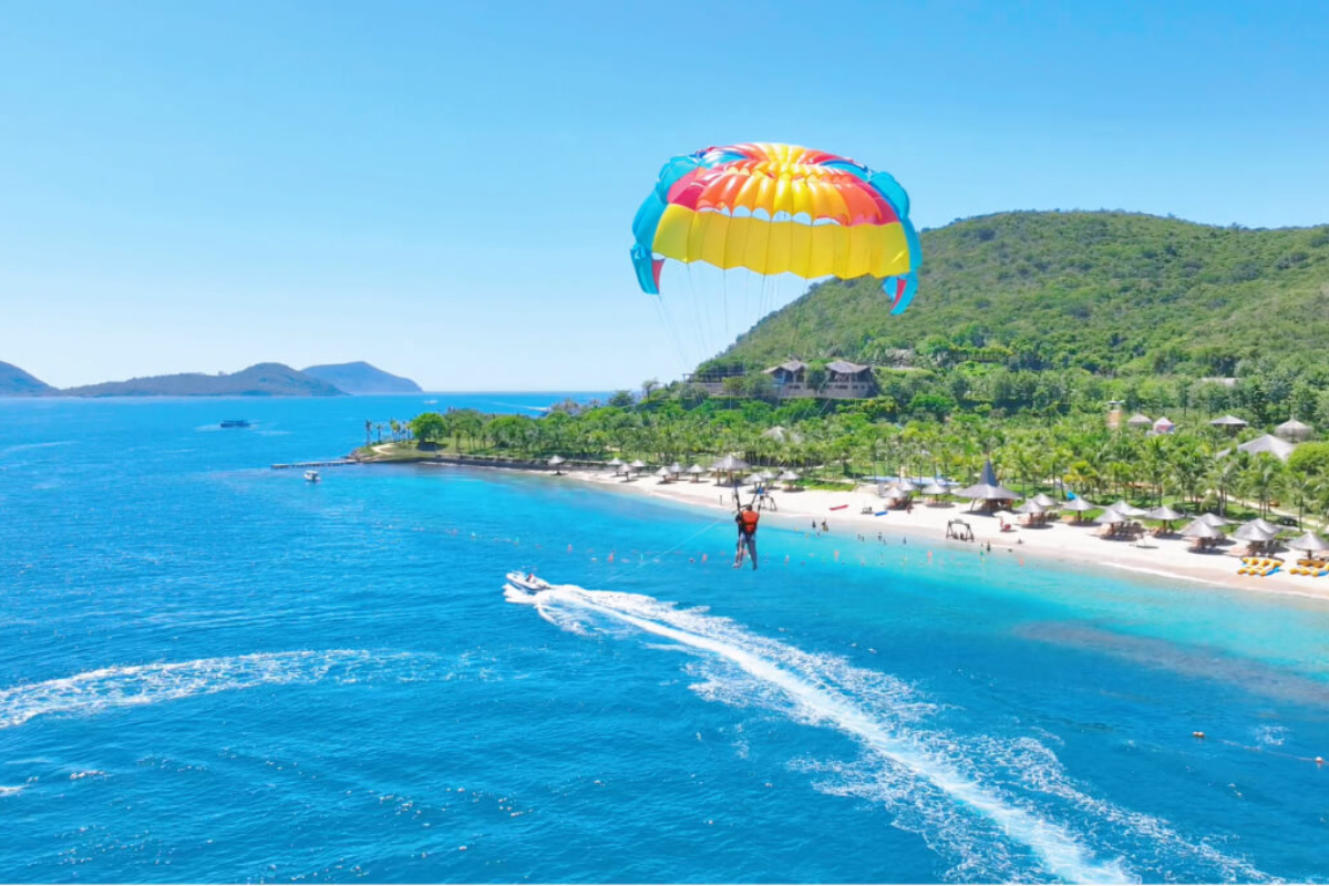 Tourists enjoying parasailing in Nha Trang