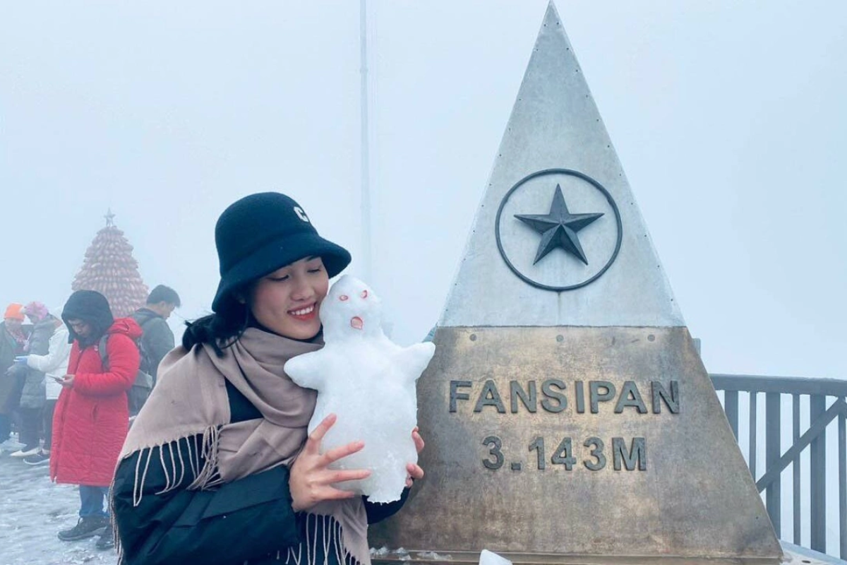 Tourists trekking through misty mountains in Sapa