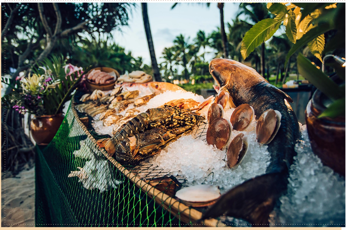 Vibrant seafood market in Ham Ninh with fresh catches displayed on boats