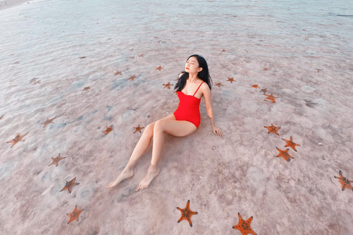 Starfish Beach in Phu Quoc with shallow waters and visible starfish