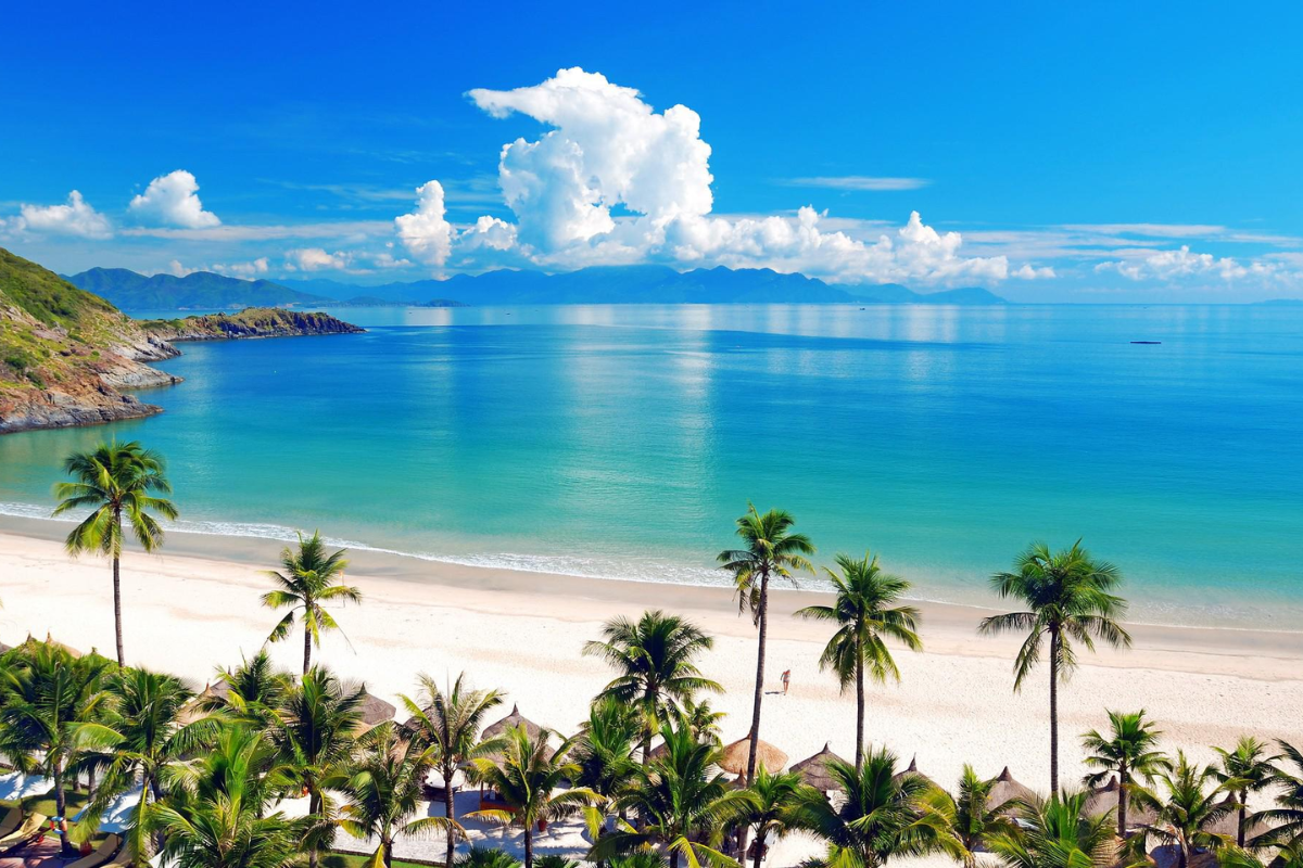 Sunny Nha Trang beach with blue skies and calm waves in February