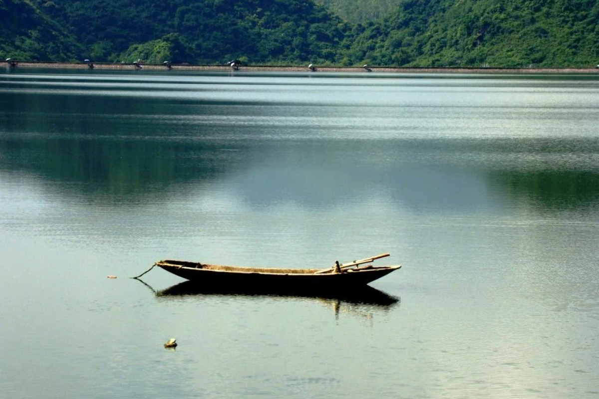 Serene lake view with temple island in Cuc Phuong National Park
